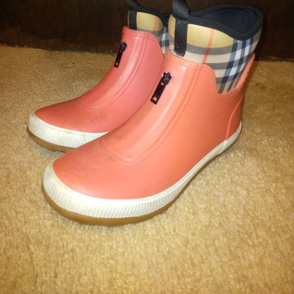 Burberry Boots: A rubber rain boot with a removable Vintage check neoprene sock